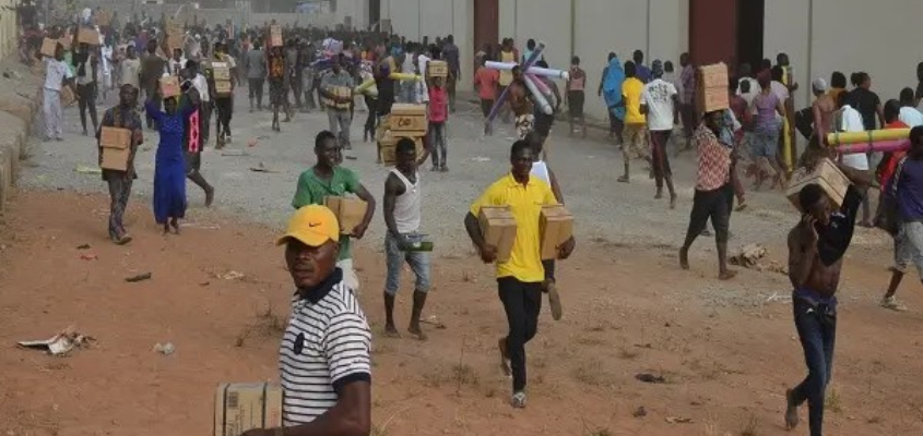Residents looting a warehouse in Nigeria