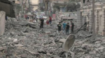 Children walking through rubble in Gaza