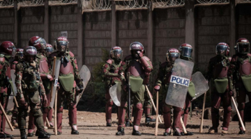 Kenyan police gather during tax hike protest