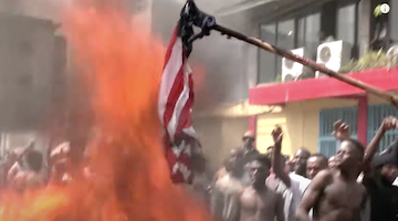 Congolese burn an American flag