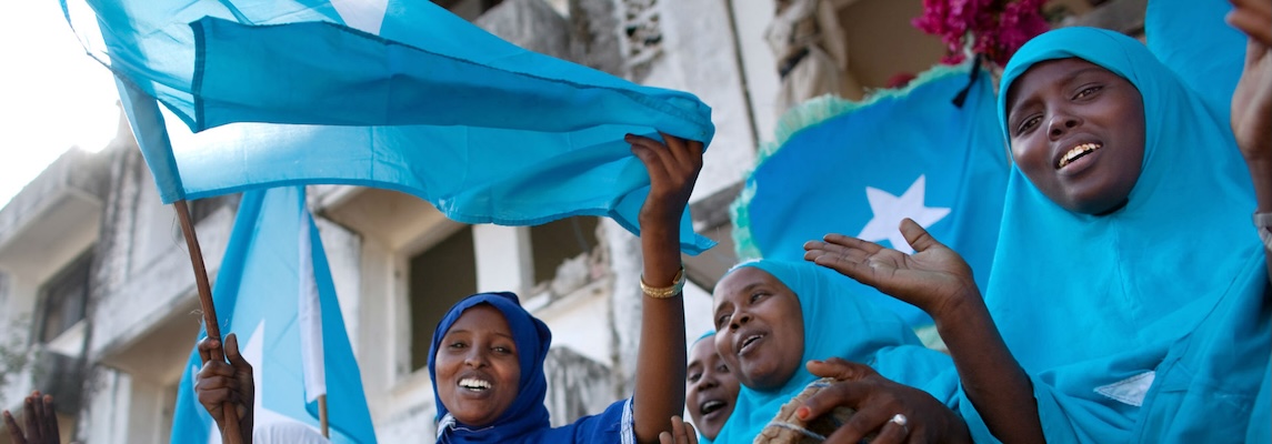 People holding the Somali flag