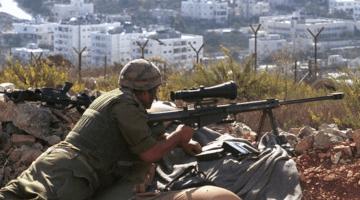 Israeli sniper prepares to implement the piece process.