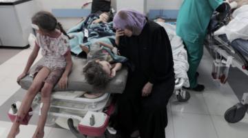 An injured child is treated at a hospital after an Israeli airstrike in Deir al-Balah, central Gaza Strip, 18 October