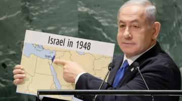 Netanyahu holding up a map of the Middle East with occupied Palestine marked as "Israel"
