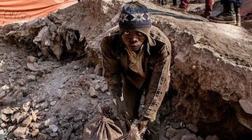 Closeup of a child working in cobalt mine