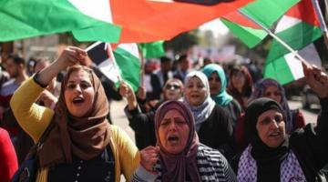 Palestinian women marching in a protest